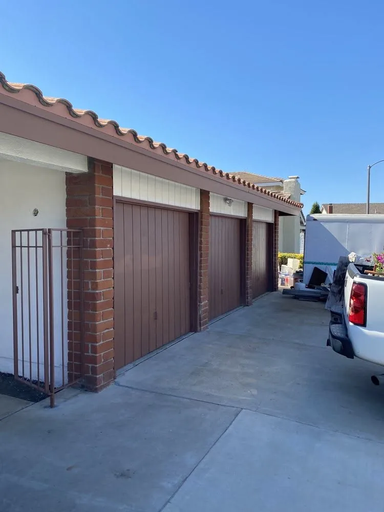 Repainted brown garage doors on a multi-unit community building