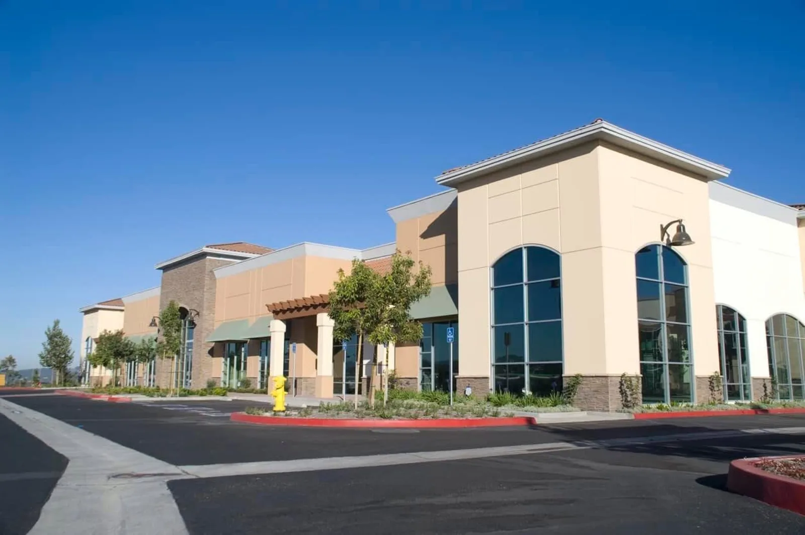 Freshly painted commercial retail plaza exterior