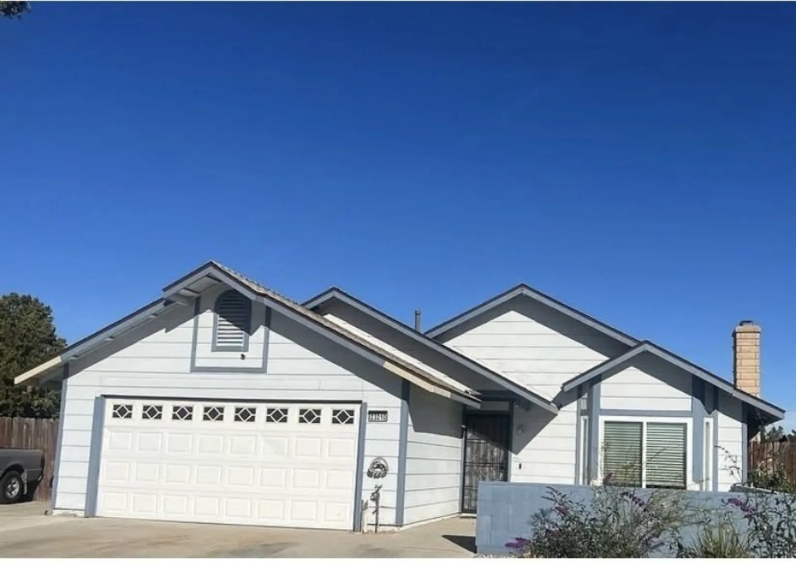 Blue-gray single-story home with fresh exterior paint