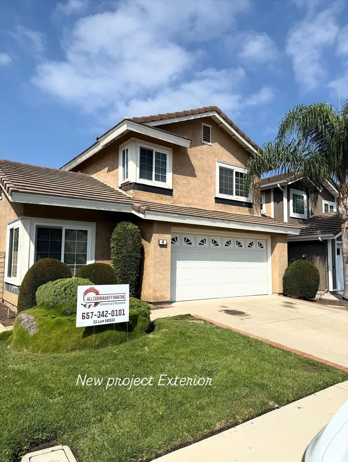 Completed residential exterior repaint with All Community Painting yard sign