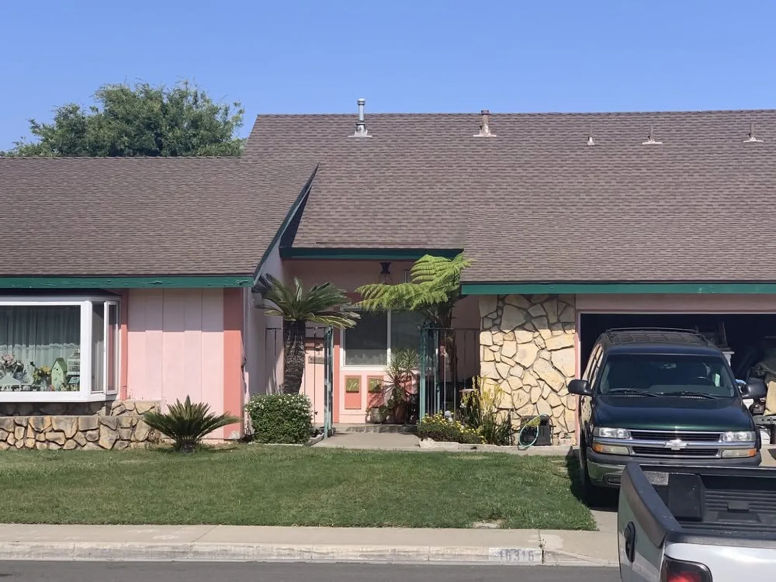 Older home exterior prepared for a full repaint