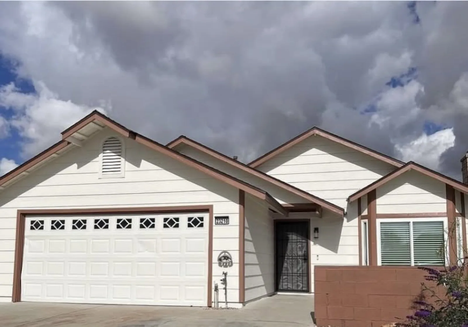 Completed white and brown residential exterior repaint