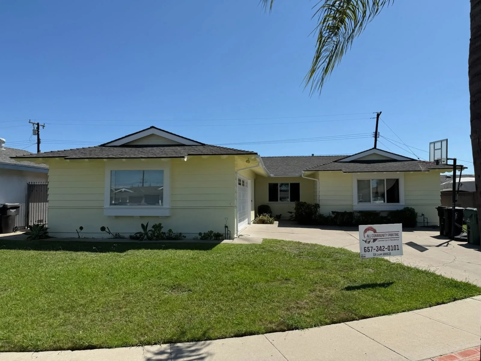 Freshly painted yellow single-story residential home in Orange County